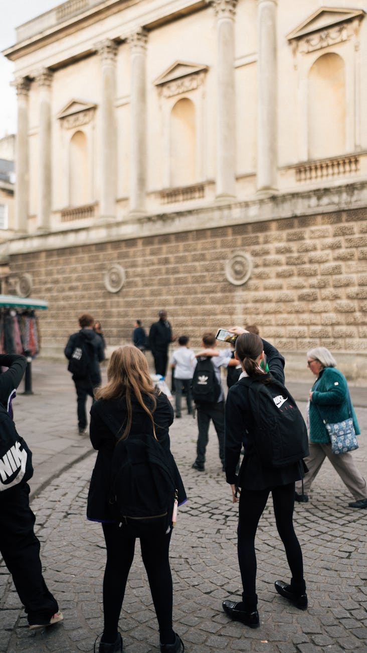 tourists exploring historic european city street